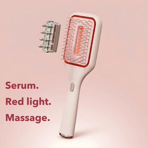 Elara Red Light Brush at an angle with its detachable serum applicator head. Serum. Red light. Massage.